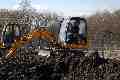 Emily and Pat on a digger